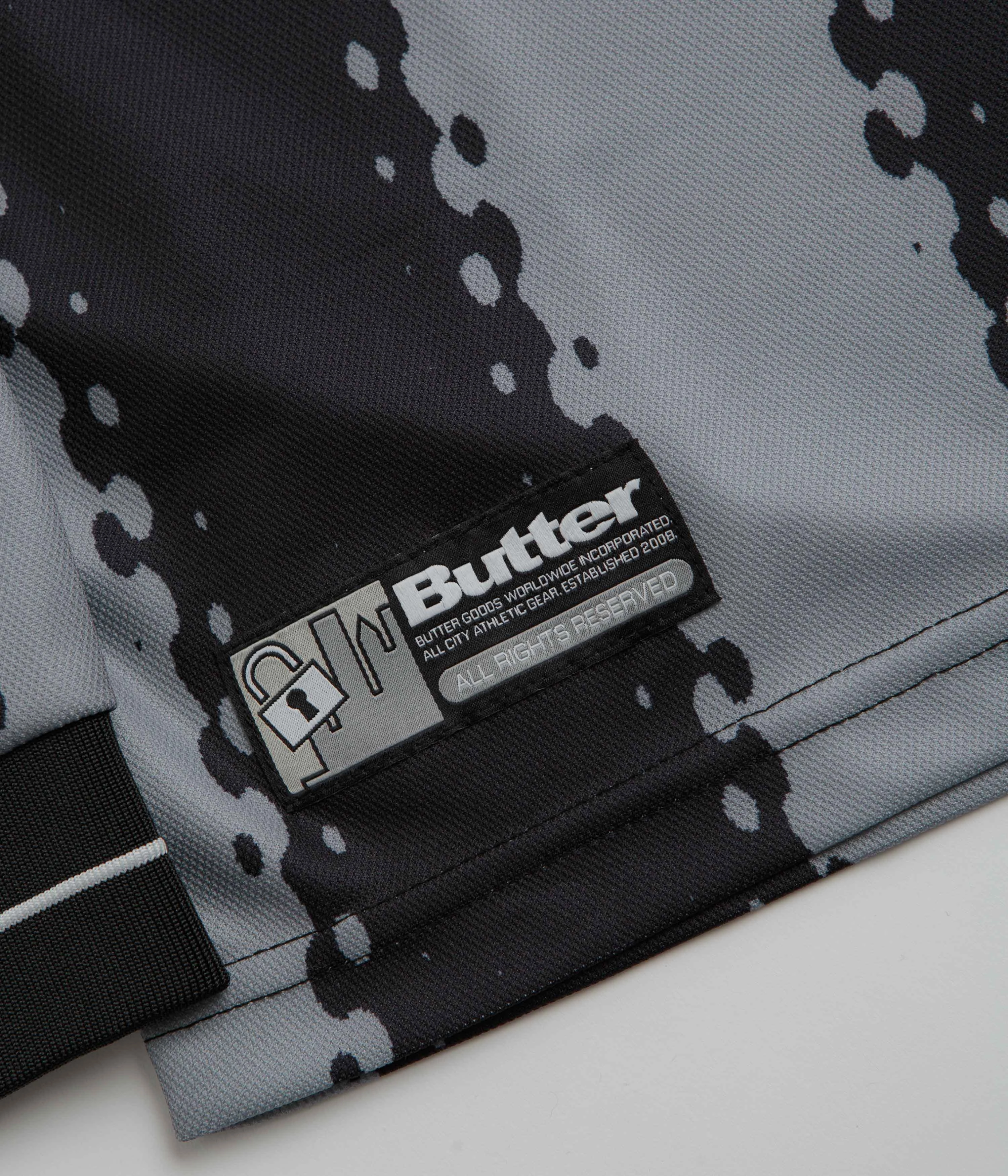 tennis event embroidered hem Butter Goods All City Long Sleeve Jersey - Black / Charcoal