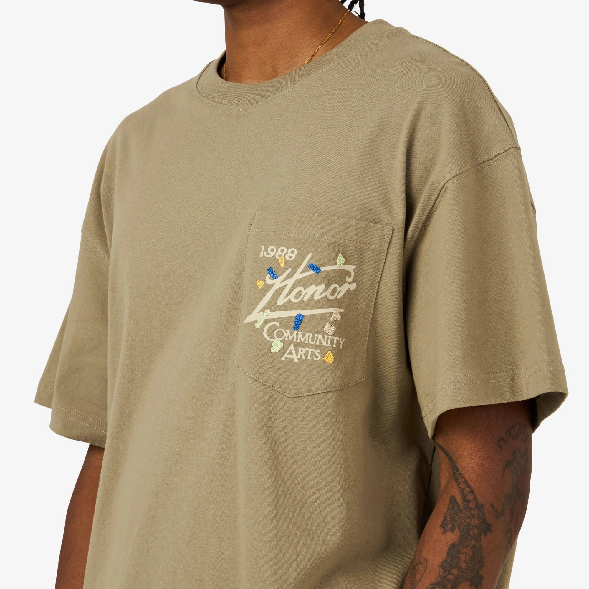 board shorts silhouette Honor The Gift Community Arts T-Shirt Pebble