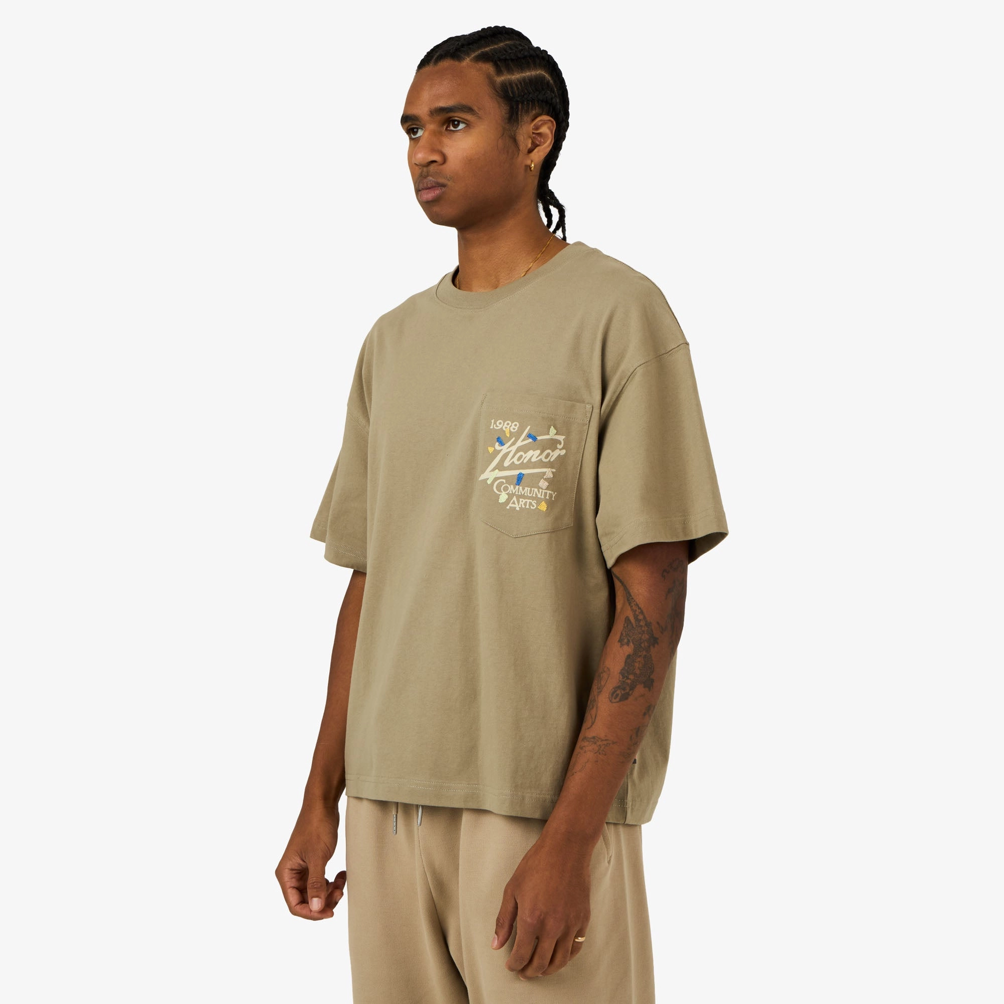 Minimalist Look theme park Honor The Gift Community Arts T-Shirt Pebble