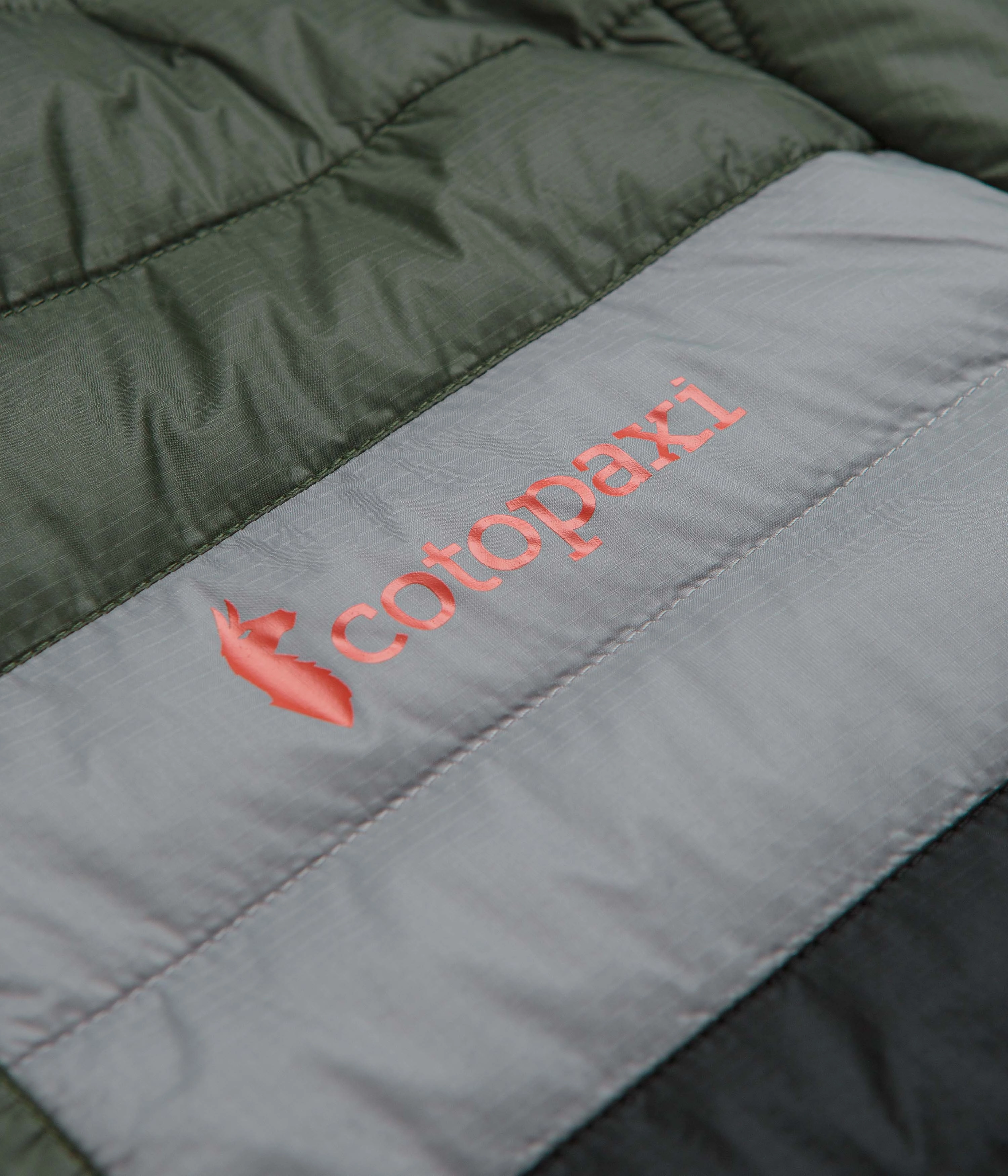 Cotopaxi Capa Insulated Hooded Jacket - Fatigue / Black Travel Light Aim